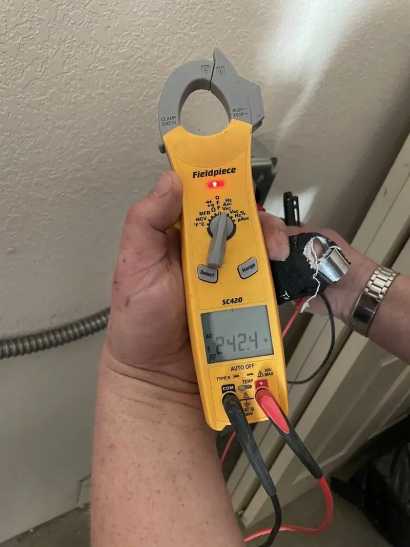 Voltage testing with clamp meter during Generator Installation in Meadow Woods